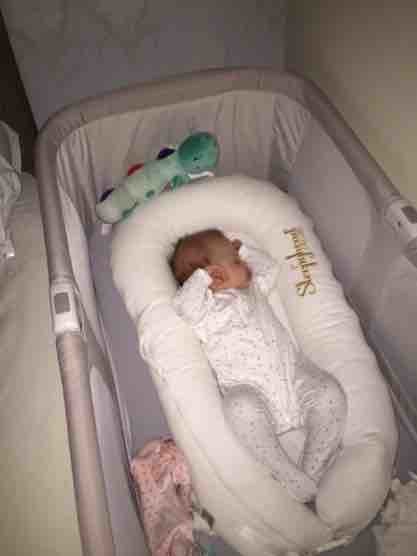 sleepyhead in next to me crib